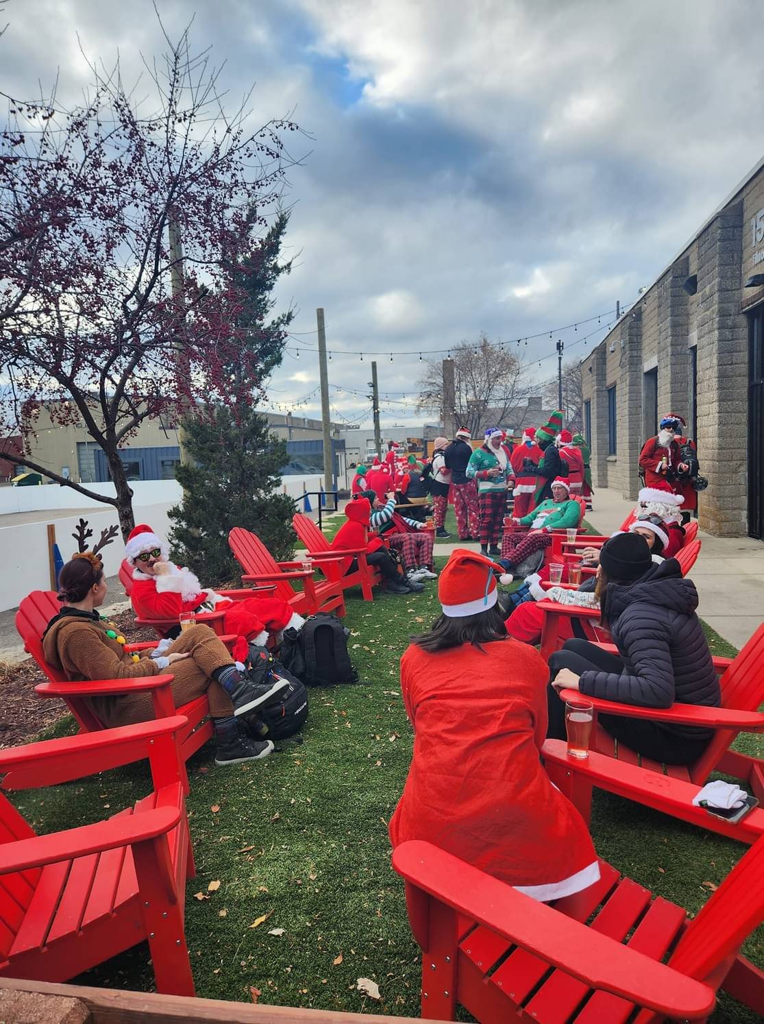 Santa Cycle Rampage riders relaxing outside at a brewery